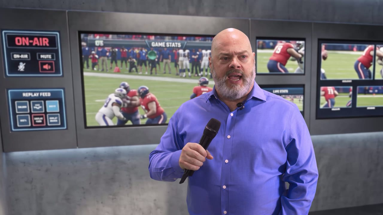 An announcer in a blue shirt with a microphone in a virtual broadcast studio, on-air graphics and game replay screens behind him