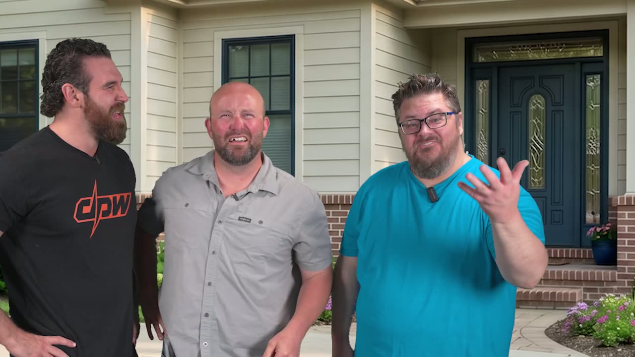 Three men standing together in front of the door of a house