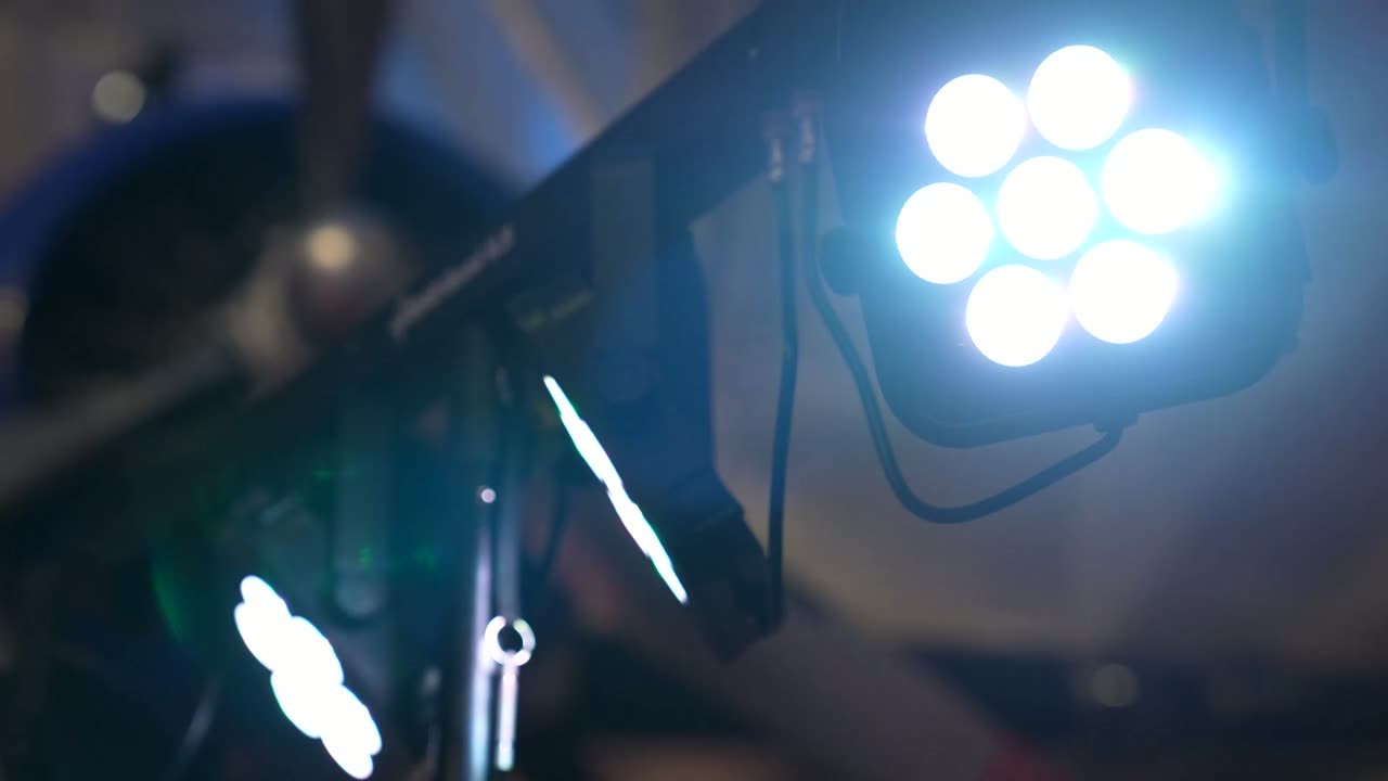 A stage light shining at a live event, the first frame of the hero loop